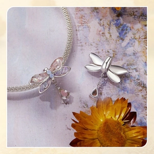 Macro shot of S925 sterling silver dragonfly beads with purple gems for DIY bracelets