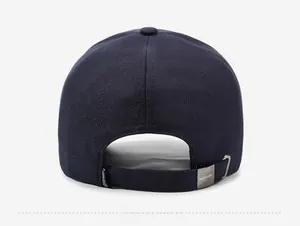 Close-up of dark blue baseball cap back with adjustable metal buckle and strap