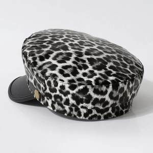 Chic black and white leopard print newsboy cap with PU leather brim and metal detail