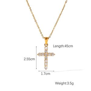 Detail view of gold cross pendant with cubic zirconia, size 2.55cm by 1.7cm on 45cm chain