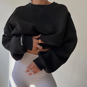 Women's oversized black knit sweatshirt with crewneck and INSTUNNING printed cuffs