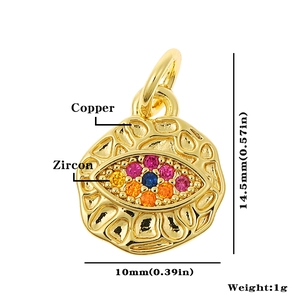 Macro detail of copper evil eye pendant with colorful zircon and size measurements