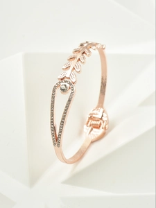 Detail view of rose gold wheat leaf bracelet with a teardrop frame and hinged clasp