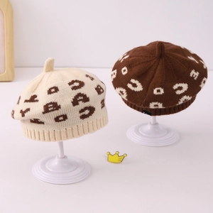 Detailed knit texture and crown top of retro jacquard letter patterns on kids beret hats