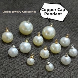 Detail of round ABS faux pearl charms with metal loop caps in gold and silver finish