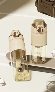 Detail of BPA-free PPSU water bottle with measurement scale and secure lock in apricot