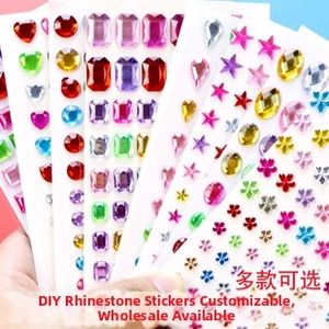 Close-up of colorful acrylic face gems set in heart star and flower shapes for DIY