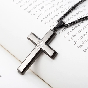 Polished black stainless steel cross necklace with inset small sparkling diamonds
