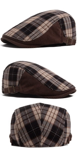 Detail of plaid newsboy cap showing brown corduroy texture and adjustable metal buckle