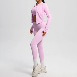 Detailed side view of 3-piece pink yoga set with zip jacket, sports bra and leggings