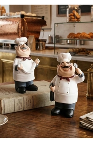 Charming chef figurines detail with detailed resin craft on rustic wooden table