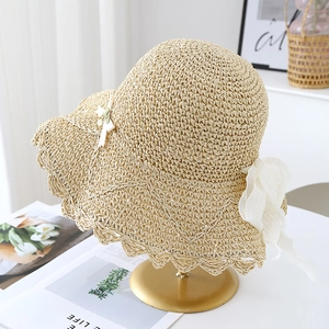 Summer wide brim straw hat with wavy edges and elegant white chiffon bow for women
