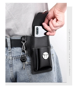 Close-up of black leather phone holster on belt featuring key hook and metal buckle