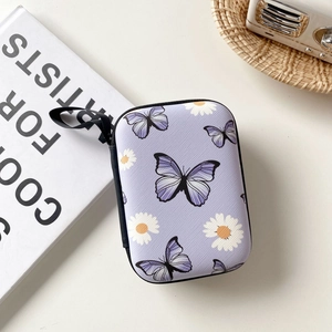 Detail of purple EVA hard shell case featuring lavender butterfly and daisy flower patterns