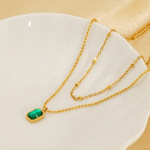 Double-layered gold stainless steel necklace with square emerald green zircon pendant