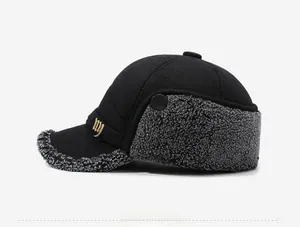 Detail of winter baseball cap featuring warm gray fleece lining and golden metal NY logo
