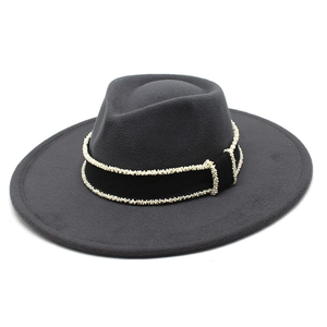 Detail of grey wool felt fedora featuring a black ribbon with white bead embellishments