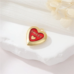 Golden heart locket pendant with red enamel and Sweet engraving on a romantic background