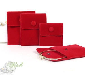 Detailed view of red velvet jewelry pouches in small, medium, and large sizes with snap closure