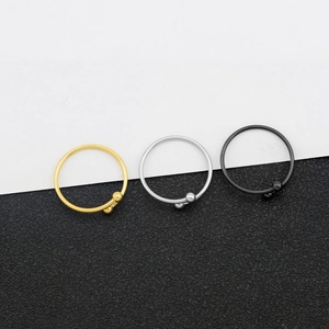 Three-piece minimalist open bead ring set in gold, silver, and black polished finish