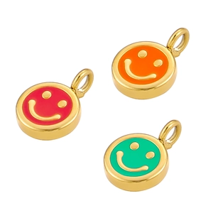 Three colorful smiley face pendants in red, orange, and green on polished gold metal