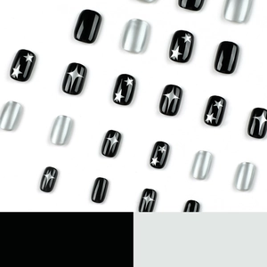 Short square Y2K press-on nails in black and metallic silver with star patterns