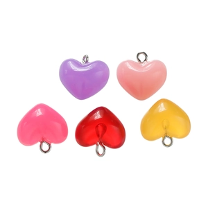 Macro shot of colorful heart pendants with silver metal loops for DIY jewelry making
