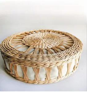 Detail showing the natural straw woven texture and fabric lining of this round mat