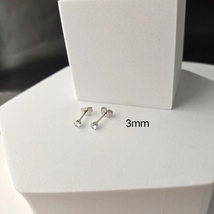 Detail view of 3mm silver titanium steel stud earrings with round white zircon stones
