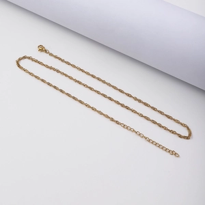Detail of 18K gold-plated water wave chain with lobster clasp and extension link