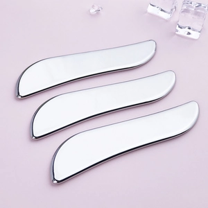 Three silver heart-shaped stainless steel Gua Sha tools for facial V-line lifting