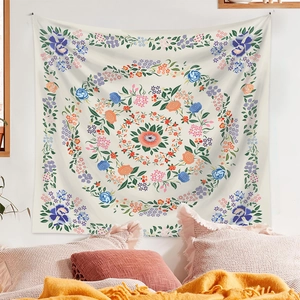 Detailed view of bohemian mandala floral tapestry hanging on a cozy bedroom wall decor