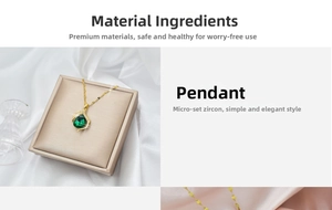 Detail of gold water drop necklace with micro-set green zircon in a beige jewelry box