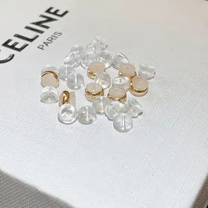 Transparent bullet and burger shaped silicone earring backs with gold metal rings