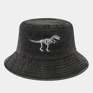 Detail of white dinosaur skeleton embroidery on black washed denim bucket hat