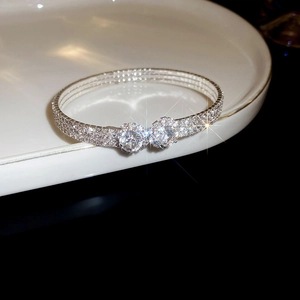 Detailed view of silver zircon flower double-layer bracelet with two large crystal stones
