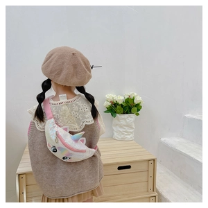 Rear view of a child wearing a colorful unicorn sequin waist bag with pink nylon strap