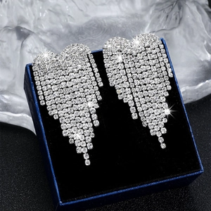 Sparkling silver long fringe rhinestone heart earrings in a luxury blue velvet gift box