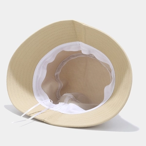 Beige bucket hat with breathable mesh lining and adjustable drawstring cord