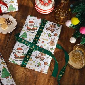 Vintage Christmas kraft wrapping paper with Santa patterns and green festive ribbons