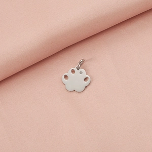 Detailed view of silver stainless steel pet paw pendant with a small sparkling crystal