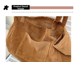 Close-up of caramel corduroy tote bag featuring reinforced handle straps and inner pocket