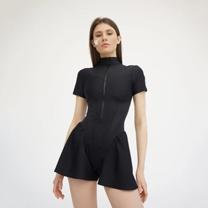 Detail of black short sleeve bodysuit featuring front zipper and ruffled skirt hem design