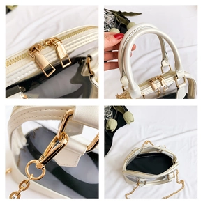 Detail of transparent PVC shell bag with white faux leather trim and gold chain strap