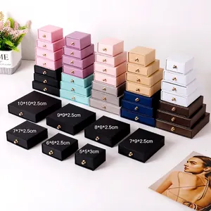 Multi-colored drawer jewelry boxes with gold metal pulls and various size options