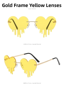Detail of gold metal frame heart-shaped sunglasses with yellow lenses and black tips