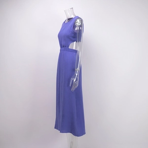 Detail of purple sleeveless dress with side waist cut-outs and waffle texture fabric