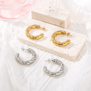 Polished chunky C-shaped twisted hoop earrings in gold and silver stainless steel
