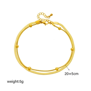 Double-layered gold stainless steel anklet with beads and lobster clasp on white background