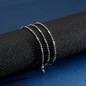 Bracelet multi-rangs en acier inoxydable argenté avec perles et cylindres polis